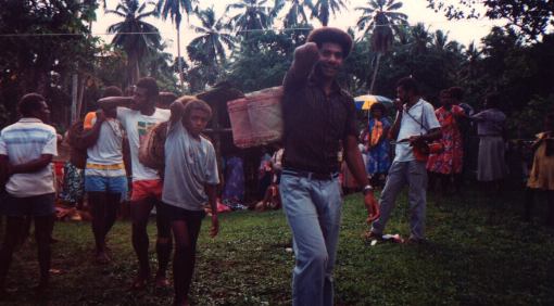 Men carrying custom mats.